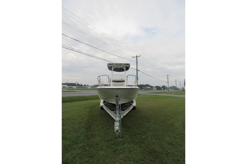Slide: The Image of 2019 Boston Whaler 240 Dauntless boat deck with storage compartments and railings. - 4