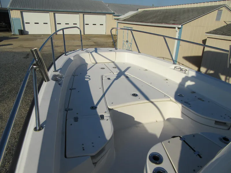 Slide: The Image of 2019 Boston Whaler 240 Dauntless boat with center console and T-top. - 5