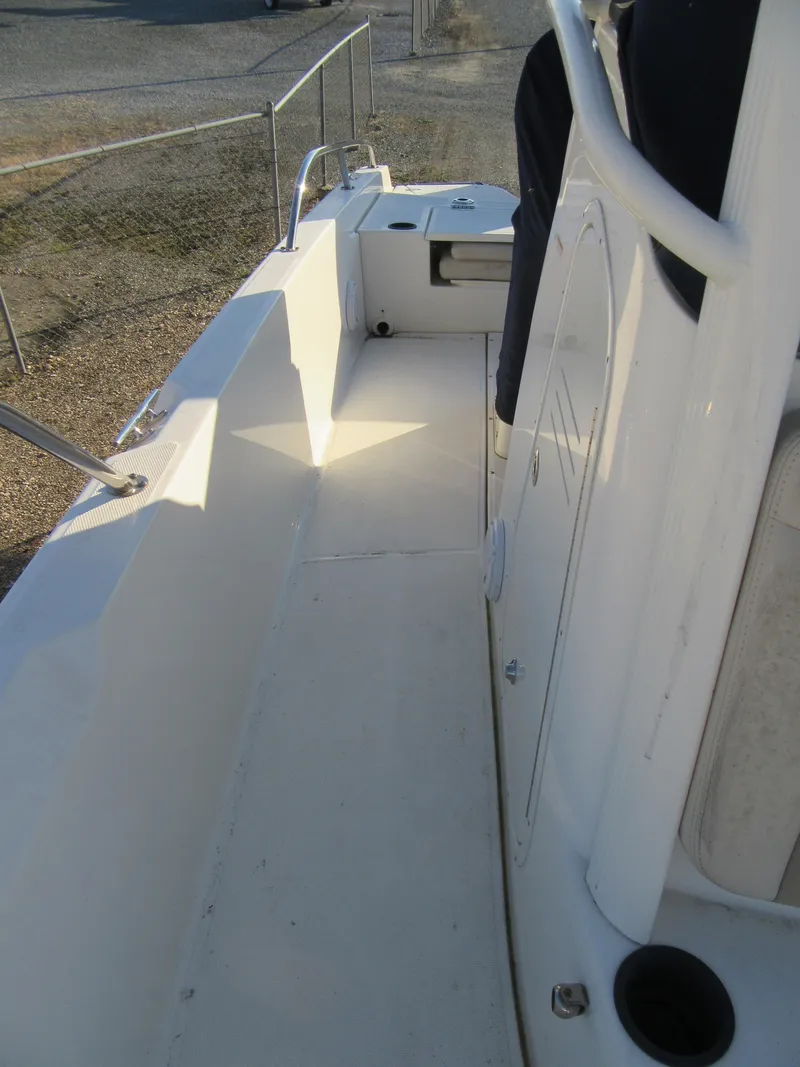 Slide: The Image of 2019 Boston Whaler 240 Dauntless boat deck with seating and storage compartments. - 7
