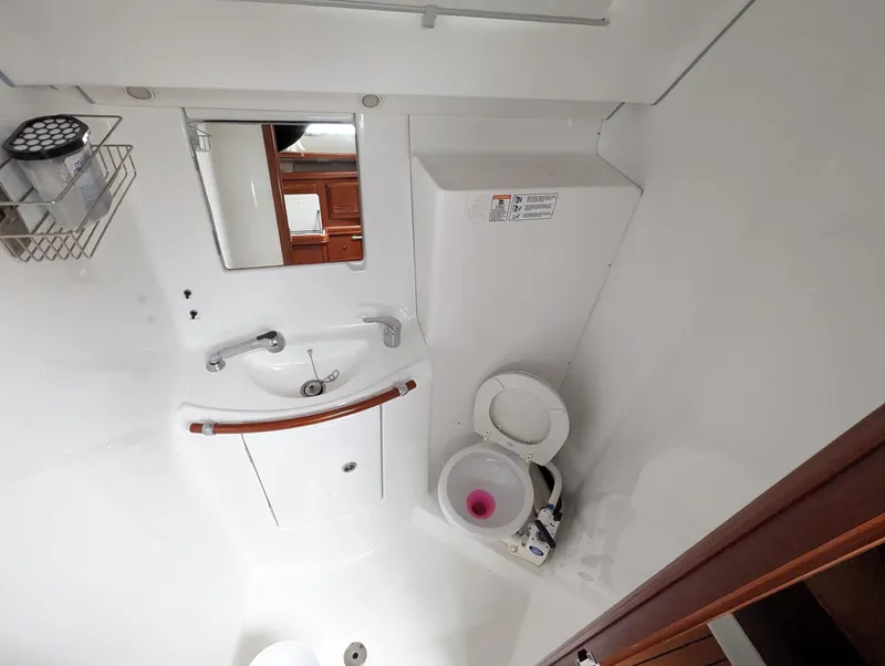 Slide: The Image of Bathroom interior of 2005 Beneteau 393 yacht with sink and toilet. - 11
