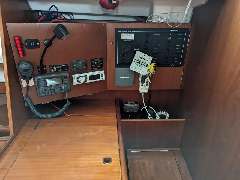 Slide: The Image of Navigation panel of a 2005 Beneteau 393 sailboat with communication equipment. - 16