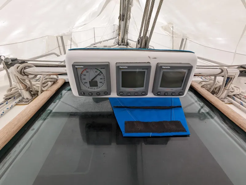 Slide: The Image of Beneteau 393 sailboat cockpit instruments, 2005 model, featuring navigation displays and controls. - 26