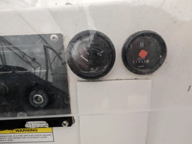 Slide: The Image of Dashboard gauges on a 2005 Beneteau 393 sailboat. - 27