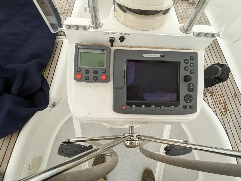Slide: The Image of Cockpit of 2005 Beneteau 393 sailboat with navigation instruments and steering wheel. - 30
