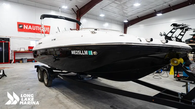 Slide: The Image of 2023 Hurricane SS188-OB boat on trailer in marina showroom. - 4