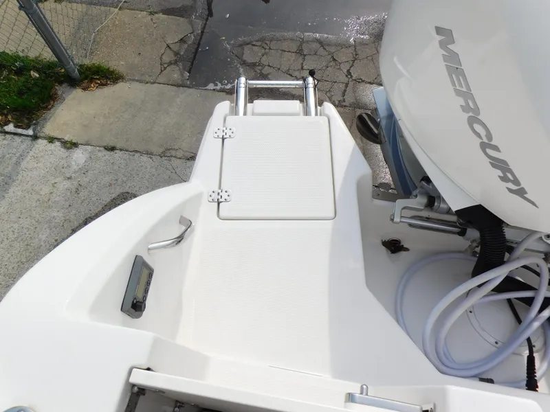 Slide: The Image of 2024 Sailfish 276 DC boat stern with Mercury outboard motor. - 15