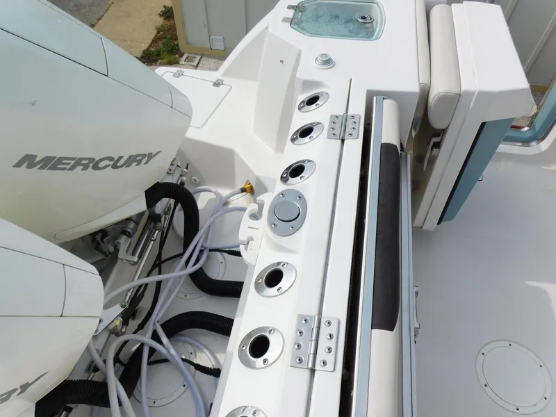 Slide: The Image of 2024 Sailfish 276 DC boat with Mercury engine and fishing rod holders. - 16