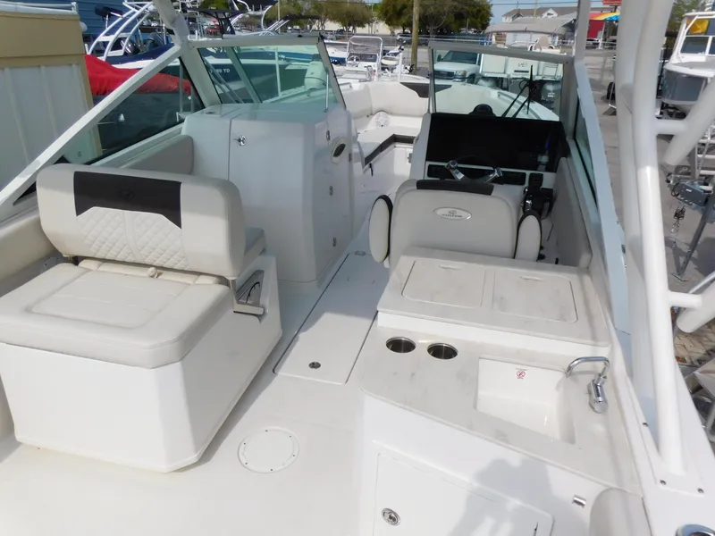 Slide: The Image of 2024 Sailfish 276 DC boat interior with seating and control console. - 17