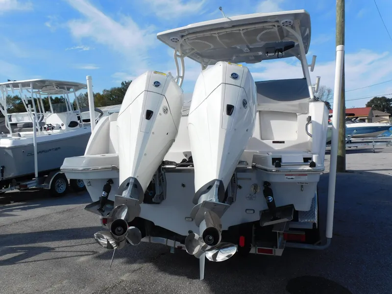 Slide: The Image of 2024 Sailfish 276 DC boat with twin outboard engines, rear view. - 2