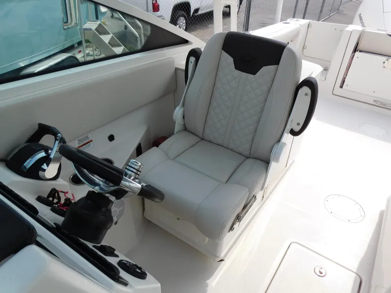 Slide: The Image of Captain's chair on the 2024 Sailfish 276 DC boat, featuring a sleek, modern design. - 23
