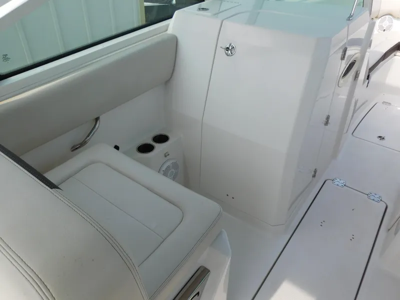 Slide: The Image of 2024 Sailfish 276 DC boat interior with seating and storage compartments. - 25