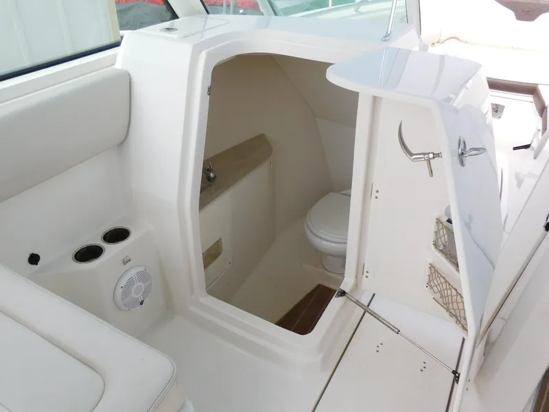 Slide: The Image of 2024 Sailfish 276 DC boat interior with a compact bathroom. - 26