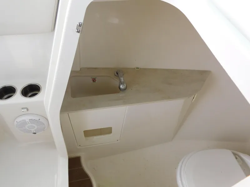 Slide: The Image of 2024 Sailfish 276 DC boat interior with sink and toilet. - 27