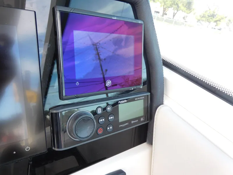 Slide: The Image of 2024 Sailfish 276 DC boat dashboard with navigation and control systems. - 7