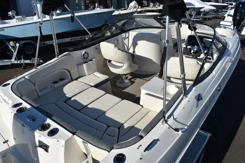 Slide: The Image of 2024 Stingray 231DC boat interior with spacious seating and modern design. - 10