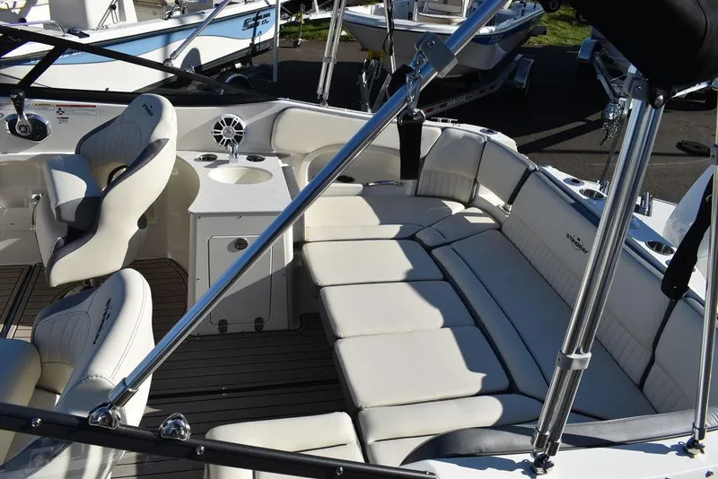 Slide: The Image of 2024 Stingray 231DC boat interior with white seating and modern amenities. - 14
