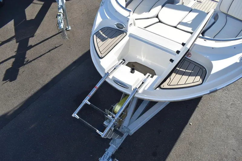Slide: The Image of 2024 Stingray 231DC boat on trailer with boarding ladder. - 18