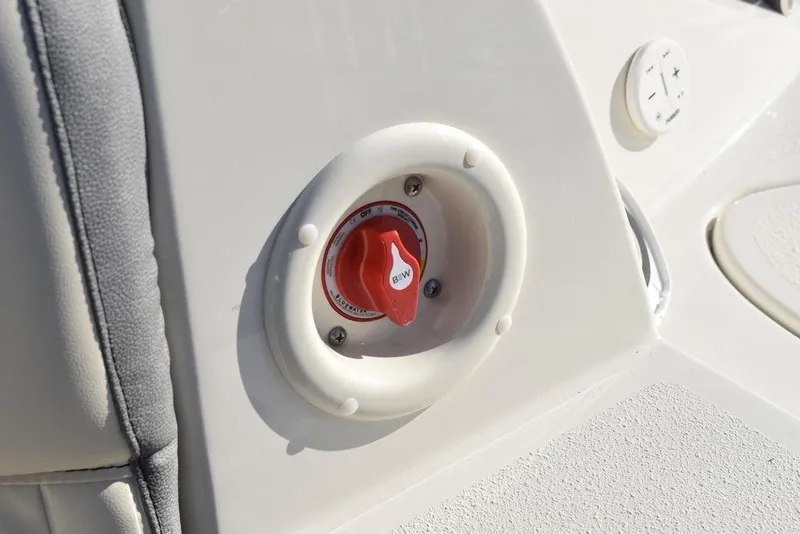 Slide: The Image of 2024 Stingray 231DC boat control panel with red switch. - 28