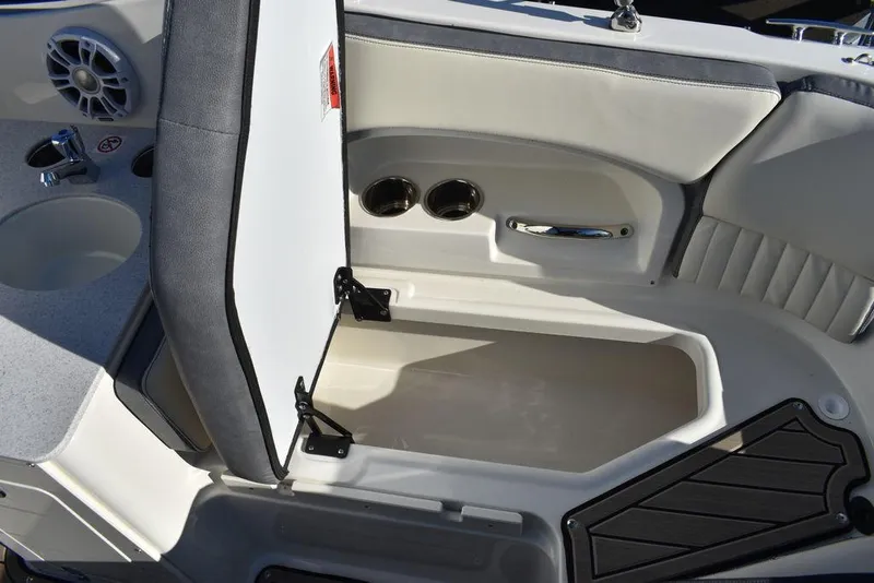 Slide: The Image of 2024 Stingray 231DC boat interior storage compartment with open seat. - 31