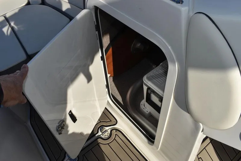 Slide: The Image of 2024 Stingray 231DC storage compartment with open door. - 44