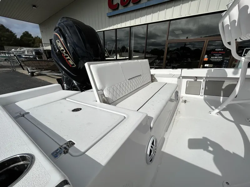 Slide: The Image of 2024 Sportsman Masters 227 Bay Boat with seating and storage compartments. - 10