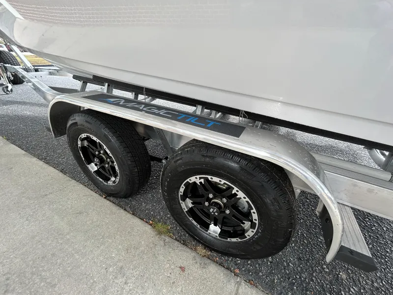 Slide: The Image of 2024 Sportsman Masters 227 Bay Boat on Magic Tilt trailer. - 15
