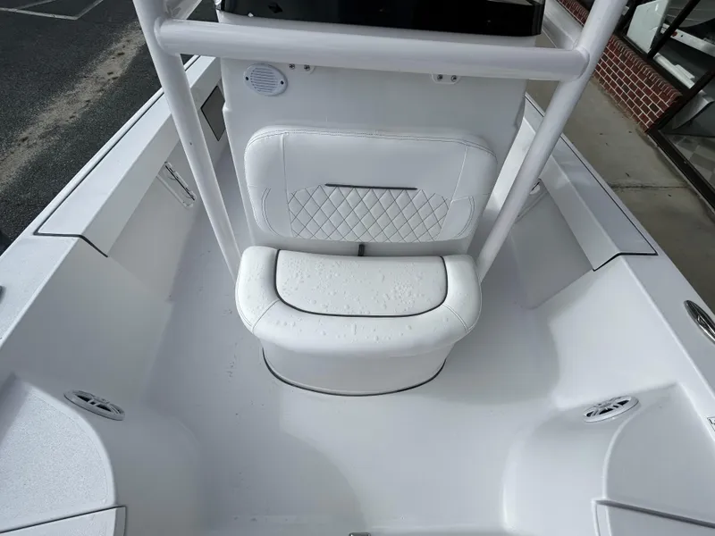 Slide: The Image of 2024 Sportsman Masters 227 Bay Boat, white interior seating and console. - 19