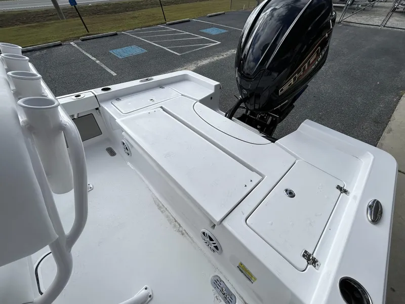 Slide: The Image of 2024 Sportsman Masters 227 Bay Boat with outboard motor in parking lot. - 22