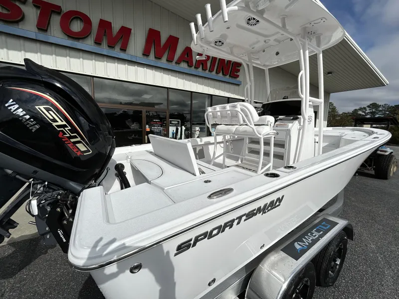 Slide: The Image of 2024 Sportsman Masters 227 Bay Boat displayed at a marine dealership. - 3