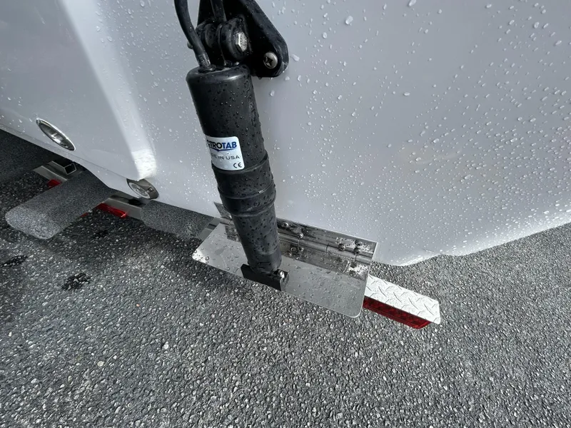Slide: The Image of Close-up of trim tab on 2024 Sportsman Masters 227 Bay Boat. - 9