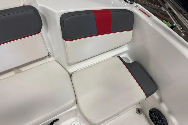 Slide: The Image of 2024 Tahoe T16 boat interior with gray and red cushioned seating. - 10