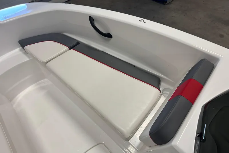 Slide: The Image of 2024 Tahoe T16 boat interior with white and gray seating, red accents. - 11