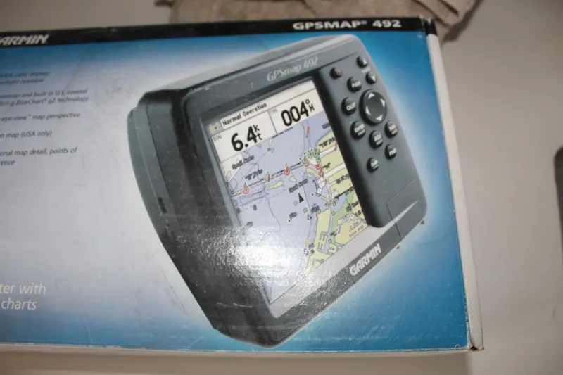 Slide: The Image of Garmin GPSMAP 492 marine GPS device in original packaging. - 19