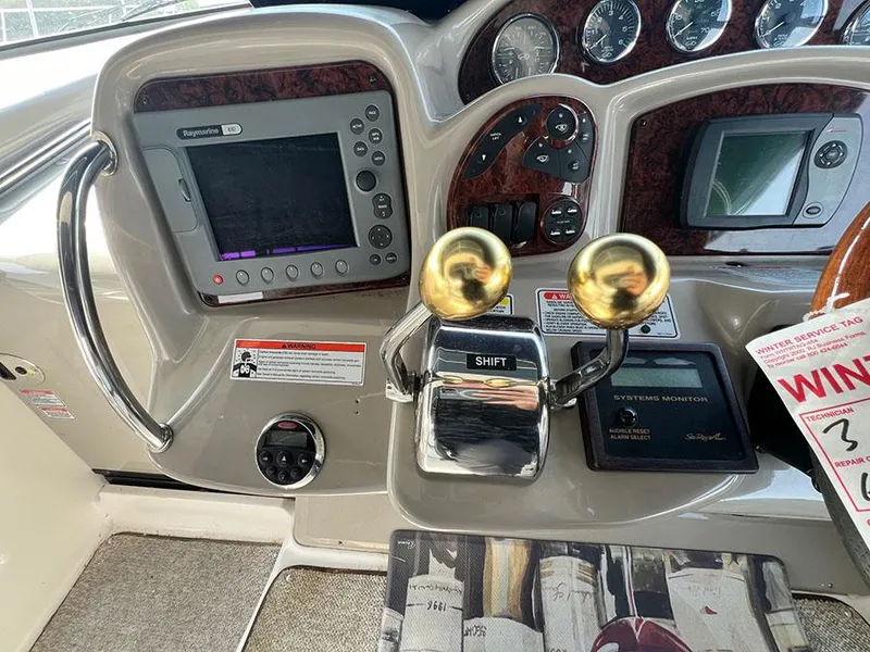 Slide: The Image of Control panel of a 2006 Sea Ray 340 Sundancer boat with navigation equipment. - 10