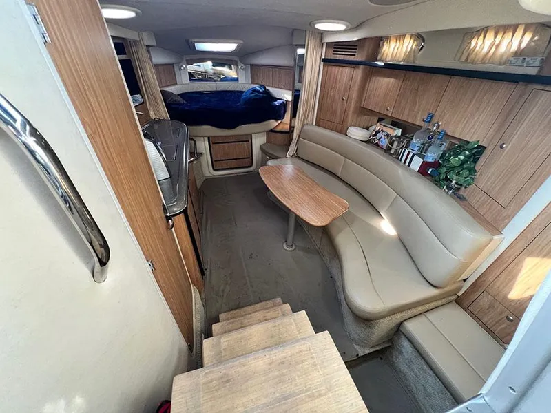 Slide: The Image of Interior of a 2006 Sea Ray 340 Sundancer yacht with seating and sleeping area. - 13