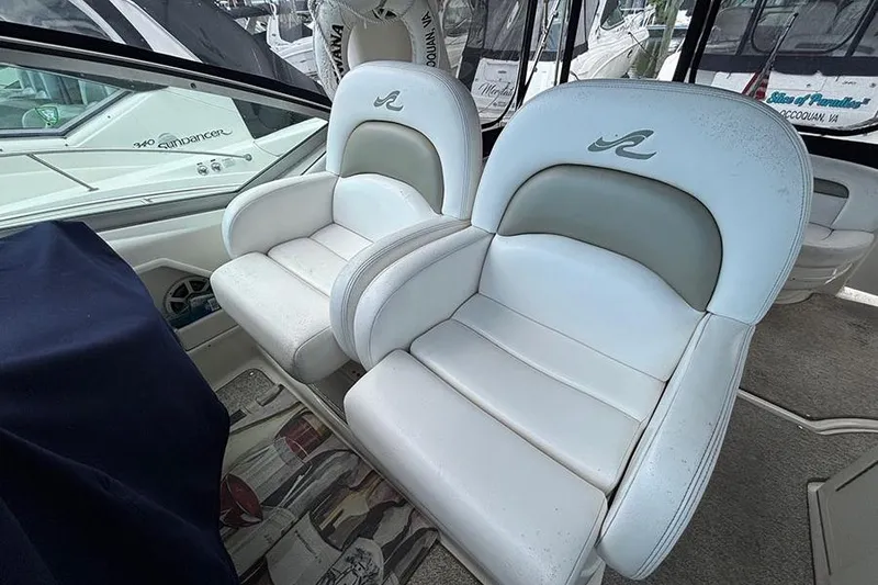 Slide: The Image of Luxury seating on a 2006 Sea Ray 340 Sundancer boat, featuring plush white upholstery. - 5