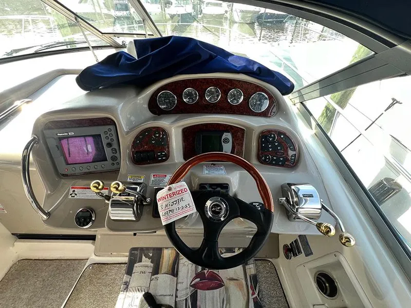Slide: The Image of 2006 Sea Ray 340 Sundancer helm with navigation instruments and controls. - 9