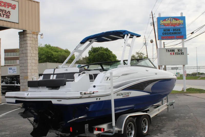 Slide: The Image of 2023 Monterey M6 boat on trailer at dealership. - 10