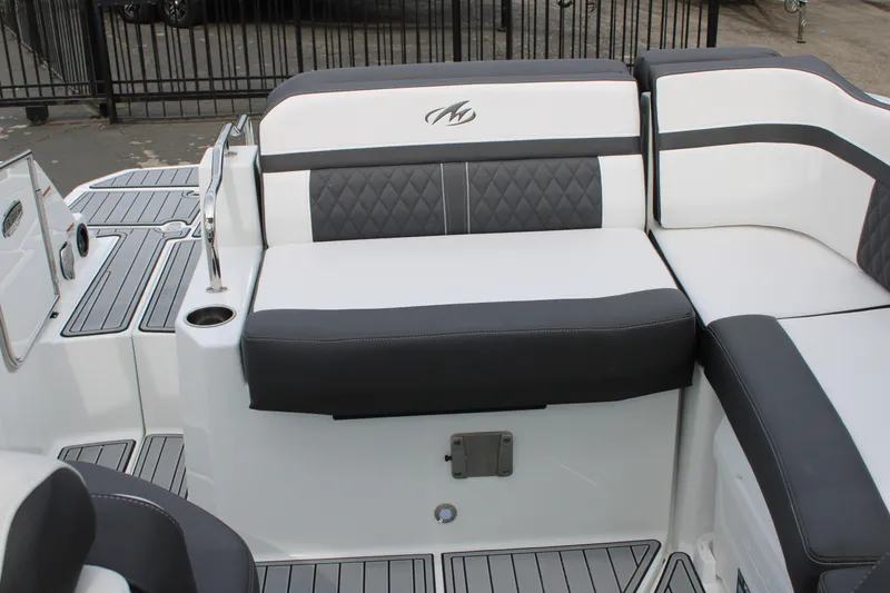 Slide: The Image of 2023 Monterey M6 boat with luxurious seating and modern design. - 15