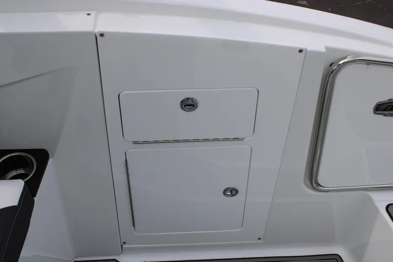 Slide: The Image of 2023 Monterey M6 boat storage compartments and seating area. - 18