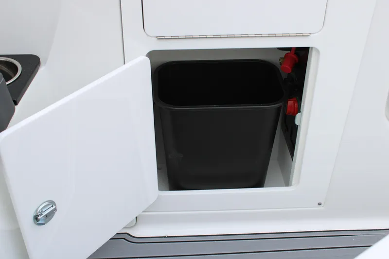 Slide: The Image of Storage compartment with black bin in 2023 Monterey M6 boat. - 20