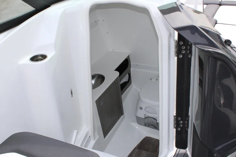 Slide: The Image of 2023 Monterey M6 boat interior bathroom with sink and toilet. - 28