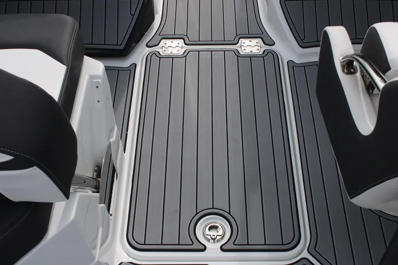 Slide: The Image of 2023 Monterey M6 boat deck with black and gray flooring. - 29