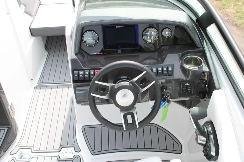 Slide: The Image of 2023 Monterey M6 boat dashboard with steering wheel and control panel. - 35