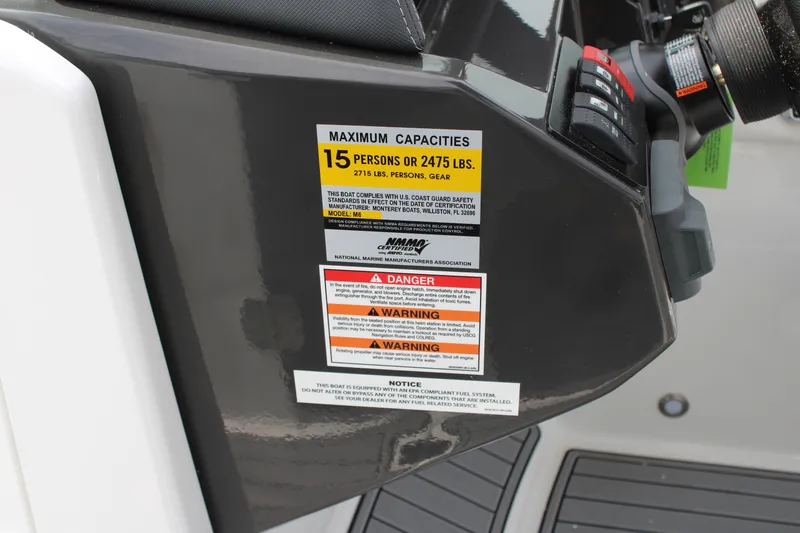 Slide: The Image of 2023 Monterey M6 boat capacity label, maximum 15 persons or 2475 lbs. - 41