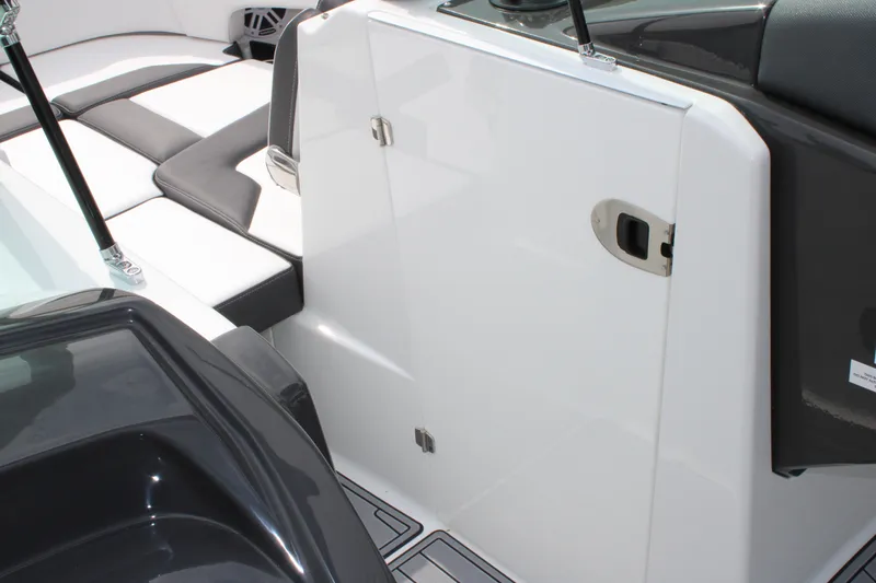 Slide: The Image of 2023 Monterey M6 boat interior with white and black seating. - 42