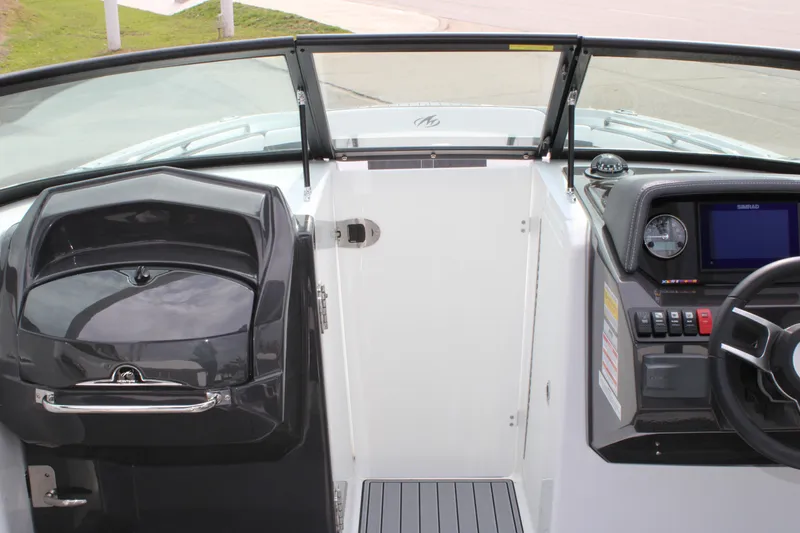 Slide: The Image of 2023 Monterey M6 boat cockpit with steering wheel and dashboard. - 43