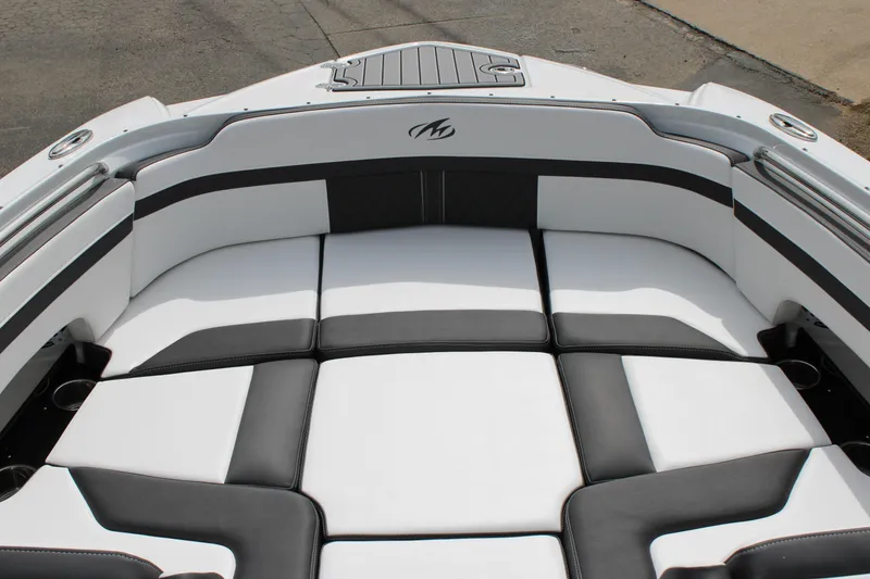 Slide: The Image of 2023 Monterey M6 boat interior with white and black cushioned seating. - 46