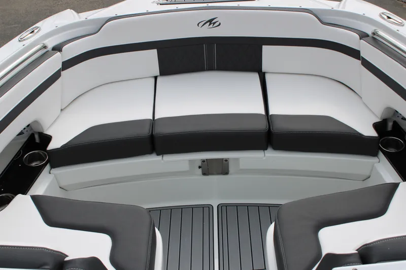 Slide: The Image of 2023 Monterey M6 boat with black and white cushioned seating. - 47