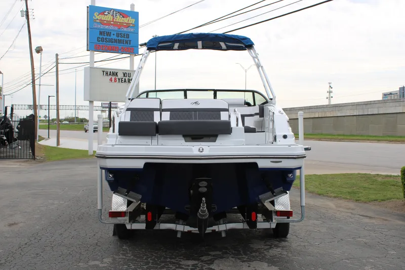 Slide: The Image of 2023 Monterey M6 boat rear view at dealership. - 9